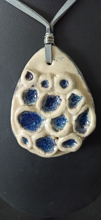Coral-inspired ceramic pendant on cord